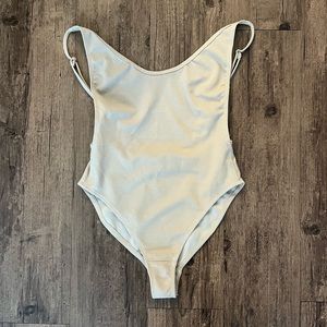 White Fox tan one piece. XS.